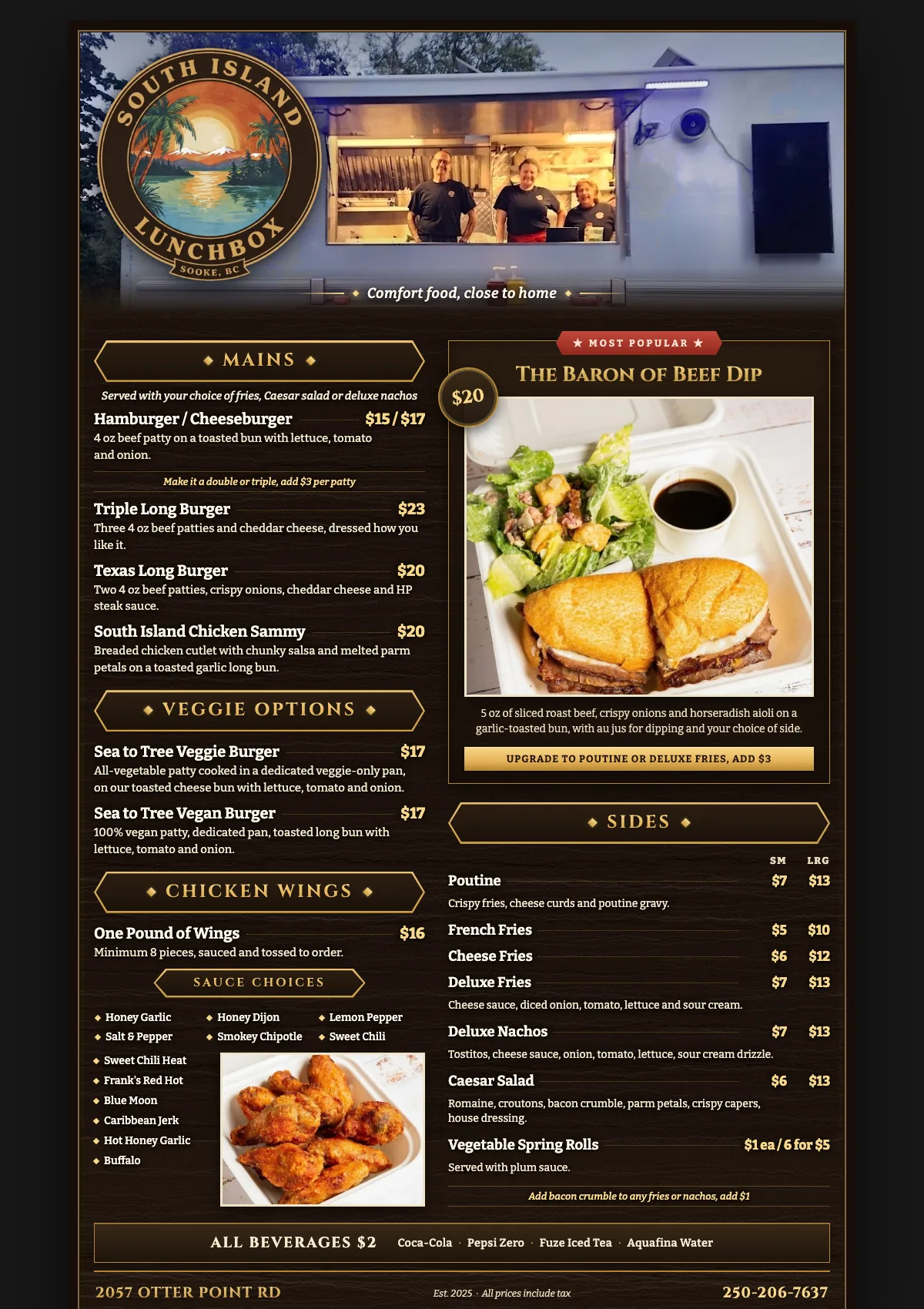 The South Island Lunchbox printed menu on a dark wood board, with gold rules and a photograph of the Baron of Beef Dip.
