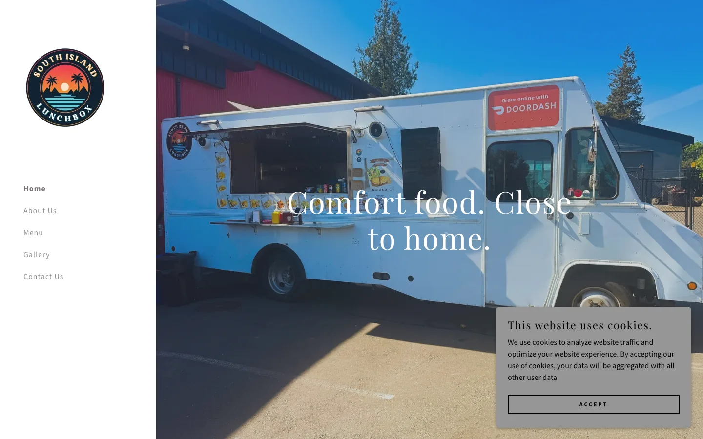 The old GoDaddy homepage: a photo of the truck, the tagline "Comfort food. Close to home." and a cookie banner. No address or hours.